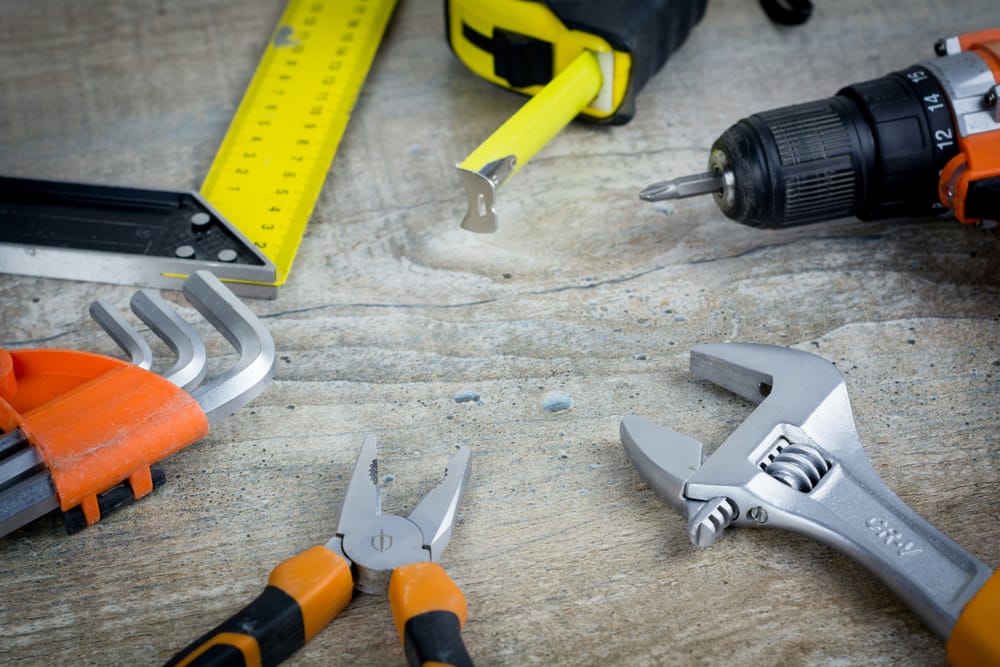 A tape measure, square, pliers, wrench and drill — the tools behind our Cleveland Heights handyman services